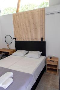 a bedroom with two beds and a table with a mirror at Ecopark Tuzlata Екопарк Тузлата in Balchik