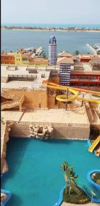 a view of a water park with a swimming pool at Porto Marina pool and sea view apartment in El Alamein