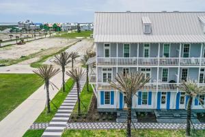 an aerial view of a house with palm trees at Luxury townhome, steps to beach and resort fun! in Port Aransas