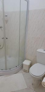 a bathroom with a shower and a toilet at Djarfogo house in S&atilde;o Filipe