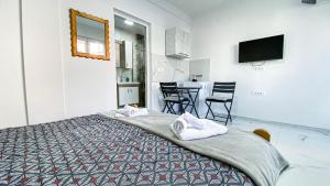 a bedroom with a bed with towels on it at Vila Shogun in Ohrid