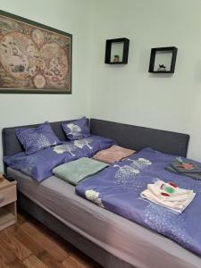 Postel nebo postele na pokoji v ubytování Manilla Vendégháza