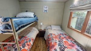 מיטה או מיטות בחדר ב-Casa Camino al Volcán