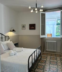 a bedroom with a large bed and a window at Caves Garden in Bari