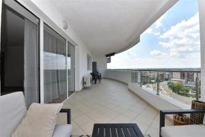 an apartment balcony with a view of the city at Apartament LUX 1 Mai Pod in Bucharest