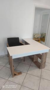 a white desk with a chair in a room at Eva's house in Kánithos