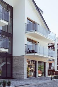 an exterior view of a building with a balcony at Sea Resort 1 & Spa in Władysławowo