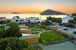 an aerial view of a small town with a sunset at Gümüşlük No3 in Bodrum City