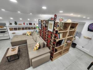 a living room with a couch and a table at Professor's Krunska Studio in Belgrade +8 photos
