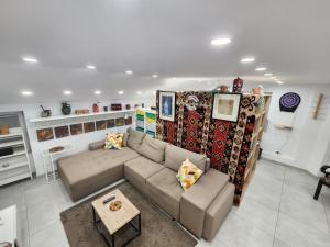 a living room with a couch and a table at Professor's Krunska Studio in Belgrade