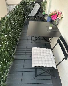 a patio with a table and chairs and plants at Bed & Breakfast Donji Grad in Zagreb