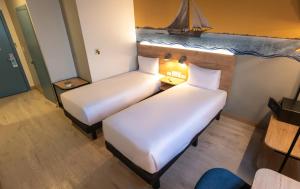 Postel nebo postele na pokoji v ubytování Ibis Styles El Malecon Guayaquil + 37 fotografií