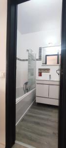 a bathroom with a tub and a sink and a mirror at Pedras d'el Rei - Casa Mira in Tavira +10 photos