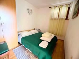 Postel nebo postele na pokoji v ubytování Apartmani Mediteran Copic
