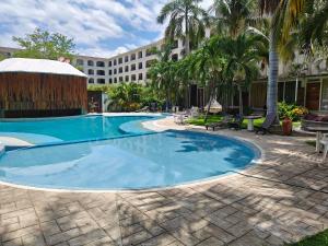 Πισίνα στο ή κοντά στο Hotel Plaza Huatulco Bungalows