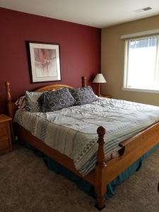 a bedroom with a large bed in a room at Lovely Mountain condo, remote workspace, 2 kayaks next to Lake Dillon in Frisco