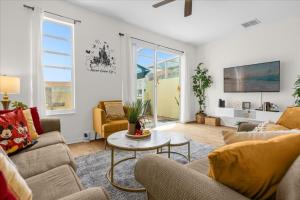 a living room with two couches and a table at 3 Bedroom 25 Bathroom Fiesta Key 4728Hh in Kissimmee