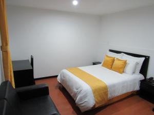 Ένα ή περισσότερα κρεβάτια σε δωμάτιο στο Hotel Palermo Suite