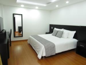 Ένα ή περισσότερα κρεβάτια σε δωμάτιο στο Hotel Palermo Suite