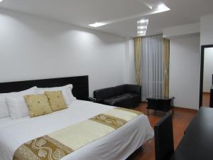 Ένα ή περισσότερα κρεβάτια σε δωμάτιο στο Hotel Palermo Suite