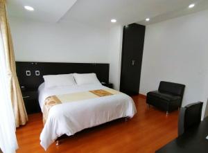 Ένα ή περισσότερα κρεβάτια σε δωμάτιο στο Hotel Palermo Suite