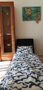 Кровать или кровати в номере Apartamento- csantos