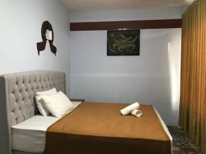 Postel nebo postele na pokoji v ubytování Bello Ethnic Bungalow & Resto
