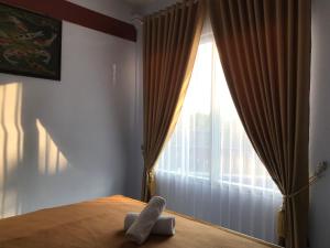 Postel nebo postele na pokoji v ubytování Bello Ethnic Bungalow & Resto