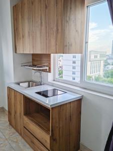 a kitchen with a sink and a window at ZEN BUILDING in Ho Chi Minh City