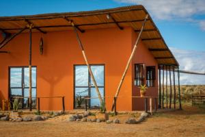 a house under construction in the outback at The Red House in Amboseli