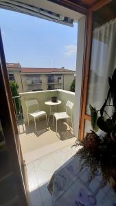 a view of a balcony with a table and chairs at Casa Doretta - Camere Rooms in Verona