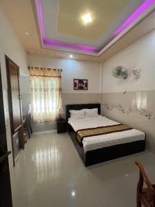 Postel nebo postele na pokoji v ubytování Ngọc Nam Hotel