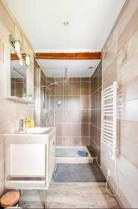 a bathroom with a white sink and a tub at La Maison de la Colline in Vers +54 photos