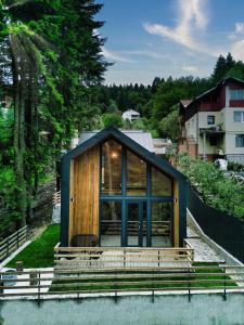 a house on a hill with a view at Norway Cabins - Private Terrace & Fire Pit in Sinaia +24 photos