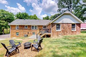 a brick house with three chairs and a table at Music City Sanctuary in Nashville