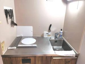 a kitchen counter with a sink and a sink at GRHOUSE -Self Check in- Will send room number and password in Tokyo
