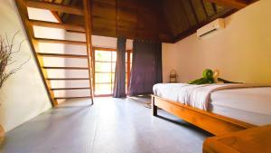 Postel nebo postele na pokoji v ubytování Majango Bungalows