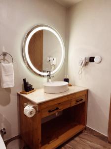 a bathroom with a sink and a mirror at Khoj Resorts in Shigar