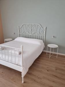 Rúm í herbergi á Three Rooms Alghero