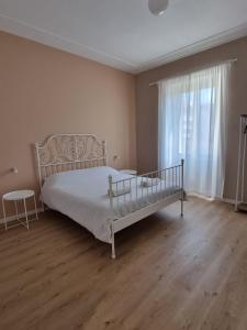 Rúm í herbergi á Three Rooms Alghero