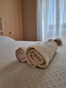Rúm í herbergi á Three Rooms Alghero