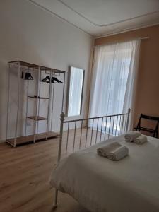 Rúm í herbergi á Three Rooms Alghero