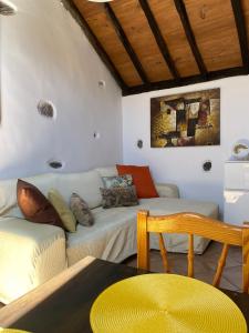 a living room with a couch and a table at La Puerta del Sol in Adeje