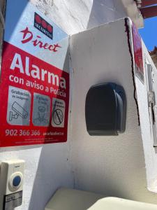 a gas station with an amana sign on it at La Puerta del Sol in Adeje