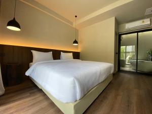 Voodi või voodid majutusasutuse Suncloud Hotel Koh Samet toas