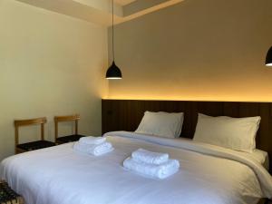 Voodi või voodid majutusasutuse Suncloud Hotel Koh Samet toas