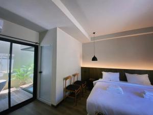 Voodi või voodid majutusasutuse Suncloud Hotel Koh Samet toas