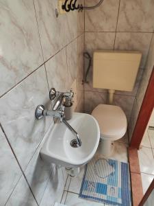 a bathroom with a toilet and a sink at Apartman Olja in Pag