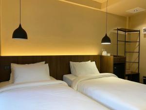 Voodi või voodid majutusasutuse Suncloud Hotel Koh Samet toas