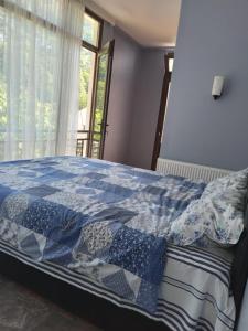 Voodi või voodid majutusasutuse Small guest house toas